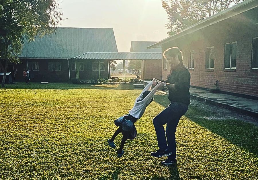 Brant dancing with a child