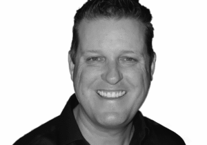 picture of Chad Mitchell in a black shirt smiling